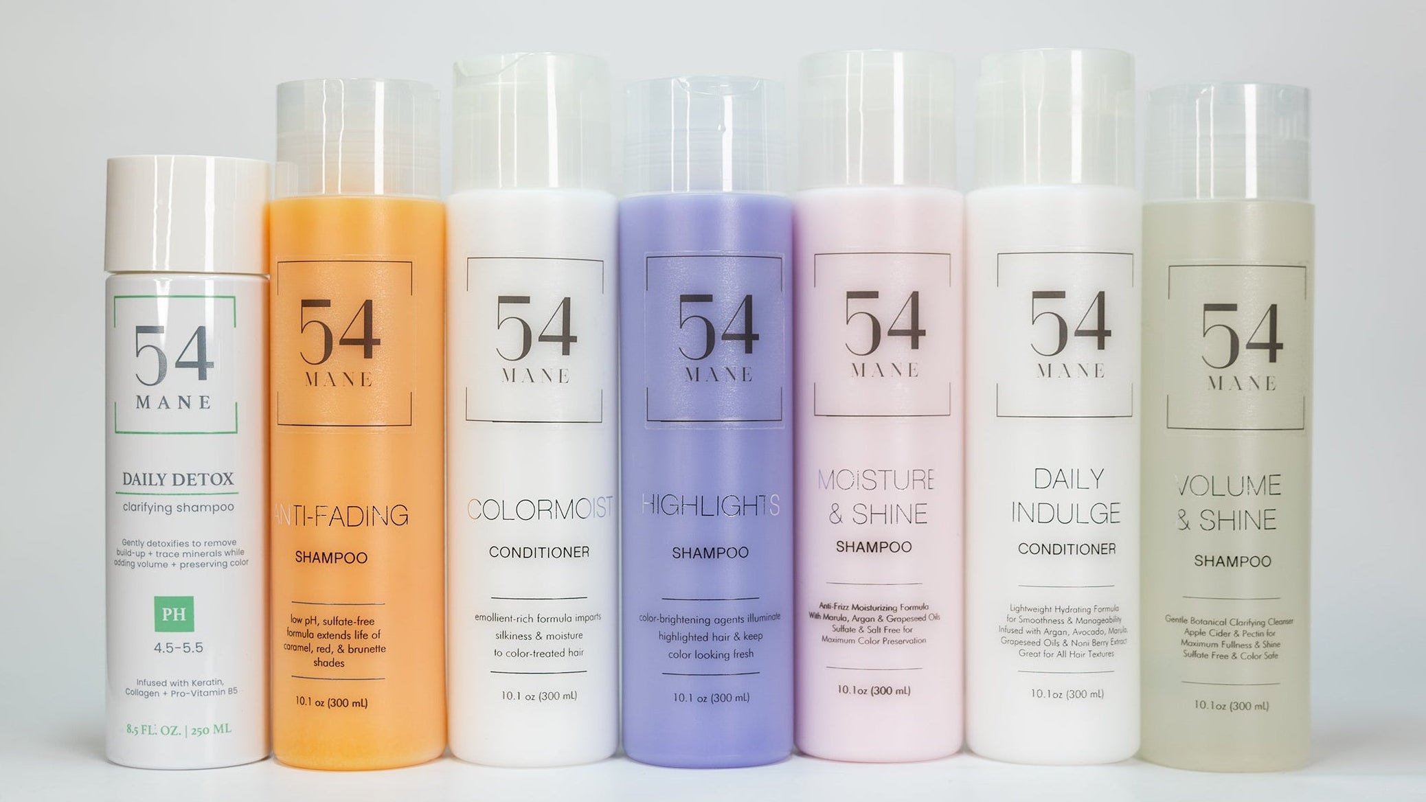 Set of 7 bottles of 54 Mane hair care products on a white background